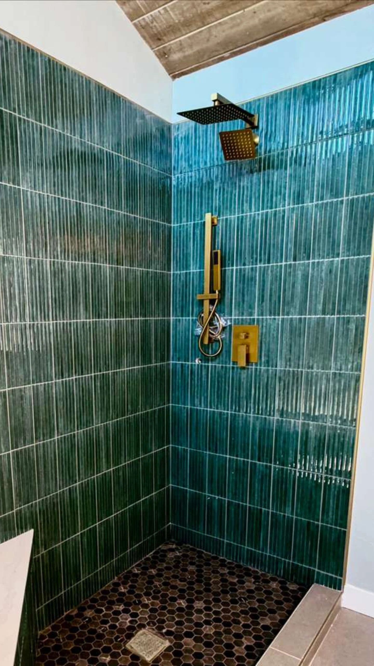 Emerald green tile shower with brass fixtures, Del Mar bathroom remodel